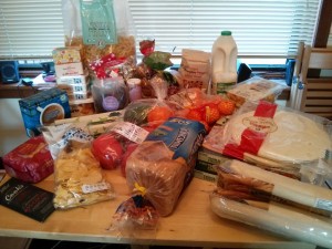 Groceries spread across the dining table